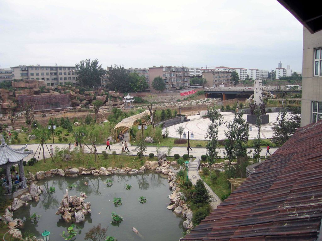 --- This wide angle shot of the new Weihsien Camp Tourist Park, taken from the window of the attic in B.61 where Norman Cliff and Stephen Metcalf were quartered for some time ---(See 206),--- [read more: Click Here]